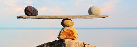 Mindfulness, rocks balancing by water