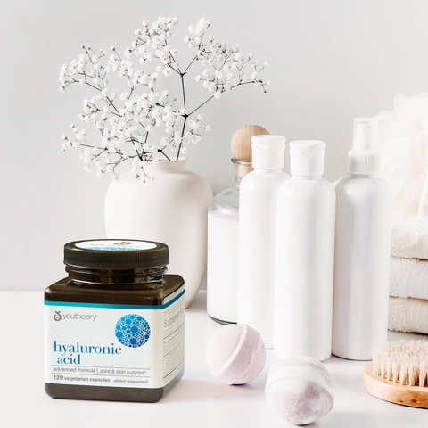 youtheory hyaluronic acid beauty supplement on a bathroom countertop