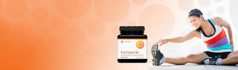 woman stretching with a bottle of youtheory turmeric in front of her