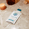 Youtheory ashwagandha liquid packet on a bathroom counter