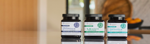 Image of youtheory®'s longevity line, featuring liposomal glutathione+, NR nicotinamide riboside, and liposomal quercetin+ on a kitchen counter.